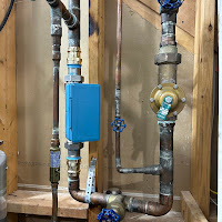 Main water line with Moen Flo smart leak detector and shutoff valves